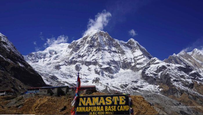 A board in front of Annapurna south face.