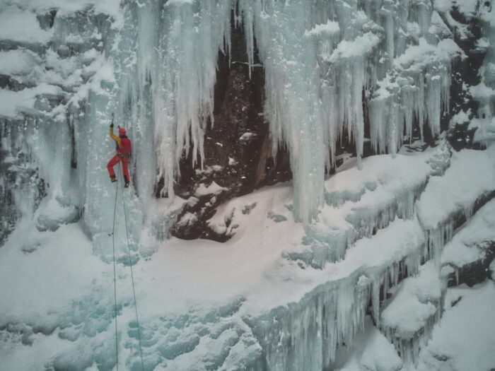 Dolmas climbing Huvudväggen, mostly free standing ice courtain.