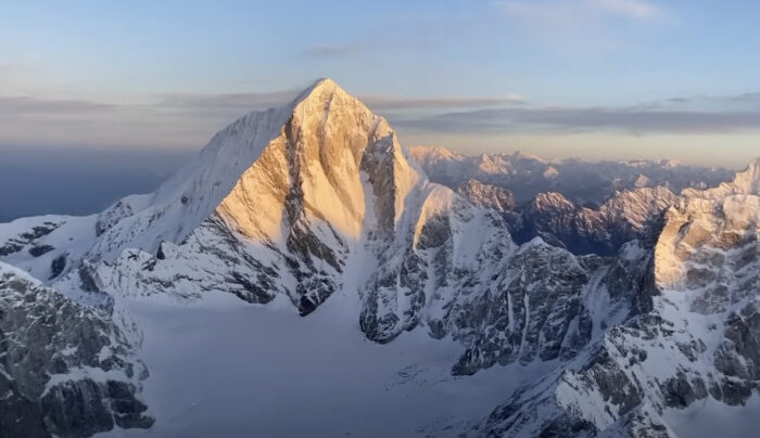 triangular mountain peak in orange alpenglow