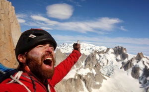 O'Driscoll shouts in triumph, Patagonian spires behind.