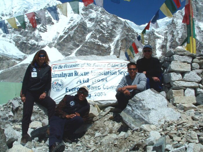 The four members of the medical team at Everest base camp, posing by a chorten.