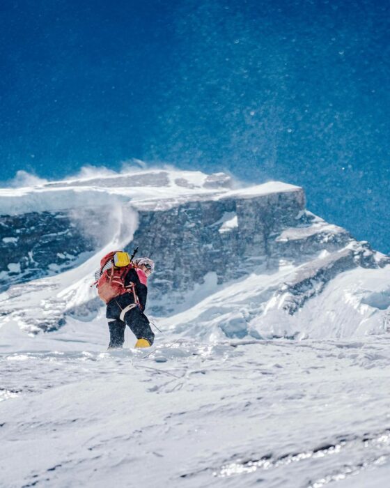 Clara approchaches the summit area on Annapurna on a windy day.