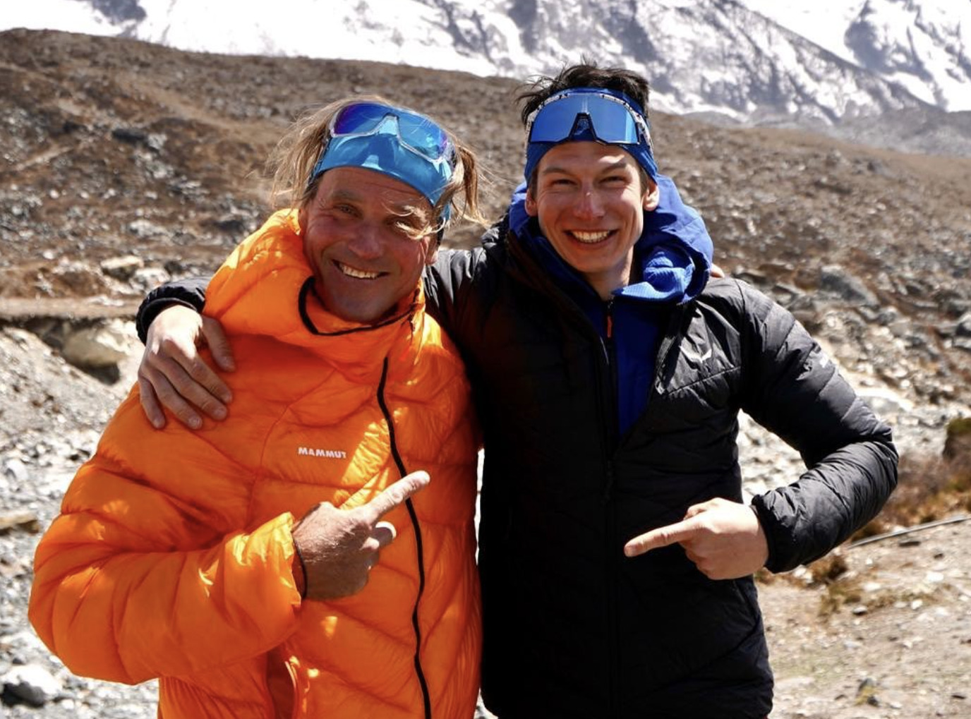 Marek Holecek, left, and Matej Bernat arm in arm at Sura Peak base camp.