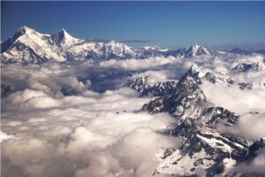 Shisha Pangma looking far away, with low clouds covering the Tibetan valleys.