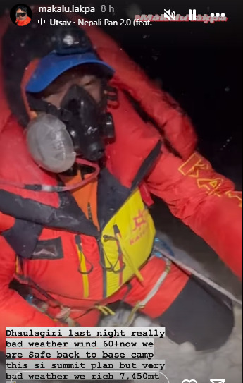 A sherpa with O2 system fights the wind while clipped to a fixed rope on Dhaulagiri