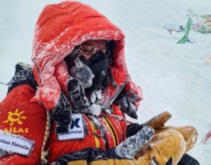 Shrestha with clothes frosted, on the summit of Everest in bad weather