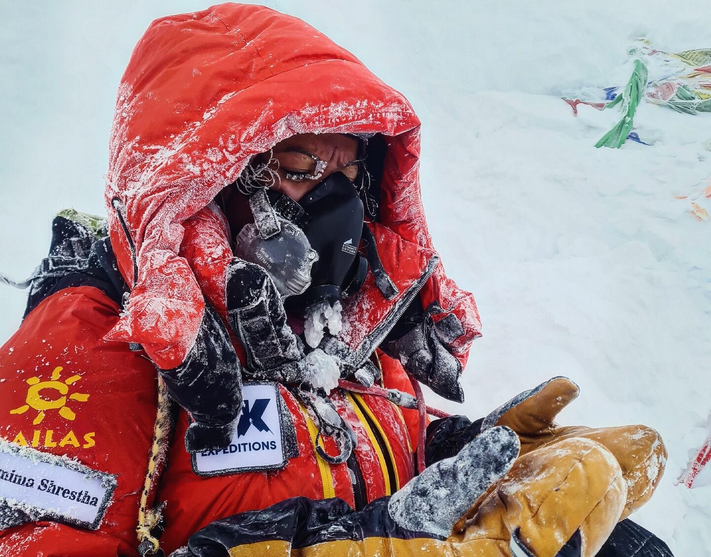 Shrestha with clothes frosted, on the summit of Everest in bad weather