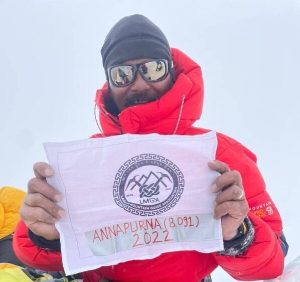 Close shot of Rigzin on a summit in the fog.