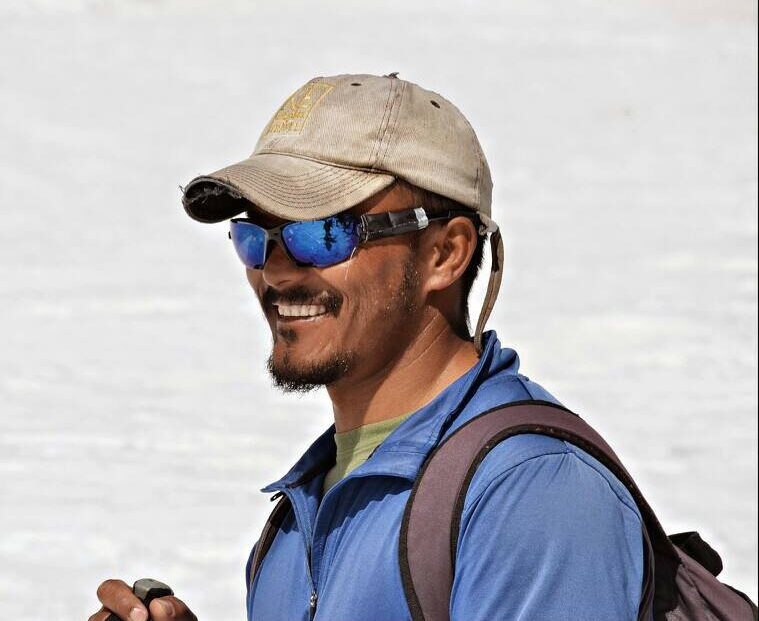 Close shot of Skalzang Rigzin with sunglasses and baseball cap