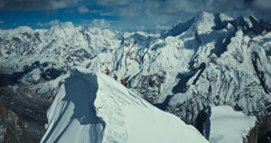 climbers with skis on their back reach the summit of the Great Trango Tower, Pakistan