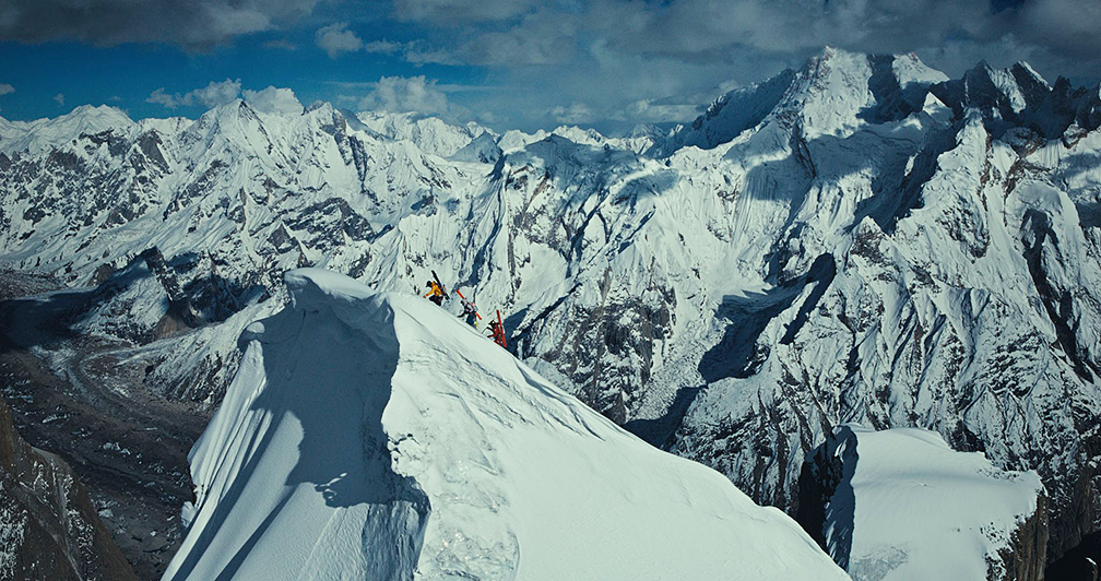 climbers with skis on their back reach the summit of the Great Trango Tower, Pakistan