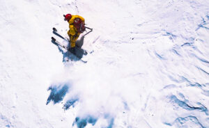 Ziemski on skis on a slope of pack snow