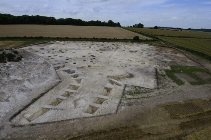 archaeological excavation with rectangular holes and pits