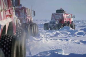 amphibious, six-wheeled vehicles in the snow