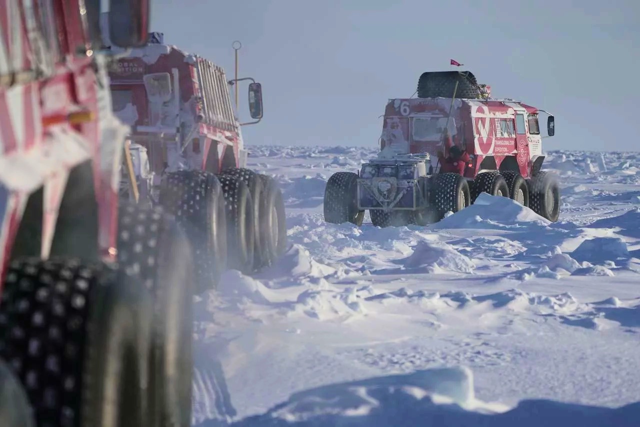 amphibious, six-wheeled vehicles in the snow