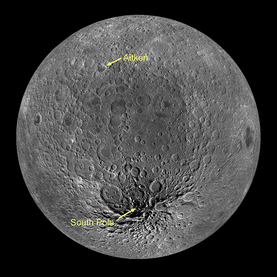 A photo of the Moon viewed from the southern hemisphere of the far side. Near the top of the image, a small crater is marked Aitken. At the bottom is the South Pole. The ground between the two is depressed, forming a massive crater.