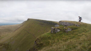fell runner on overcast Welsh ridgeline