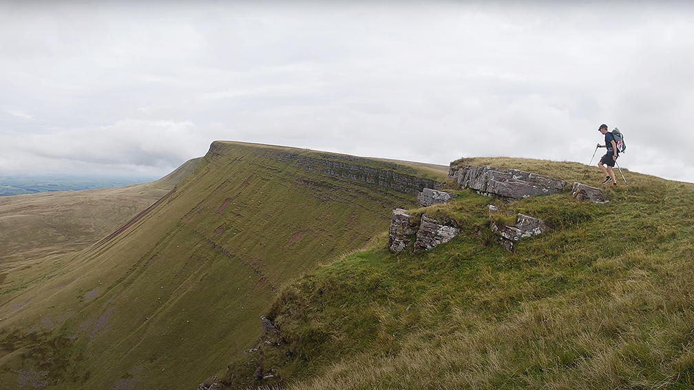 fell runner on overcast Welsh ridgeline
