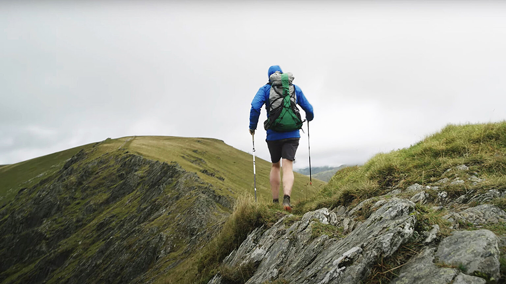 fell runner in overcast weather
