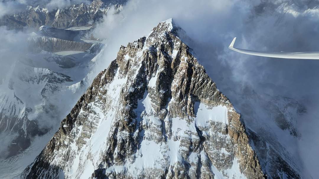 K2 with clouds behind it from the air.