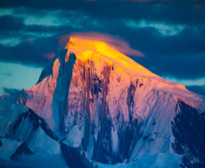 Golden light on the summit of Spantik at sunset.