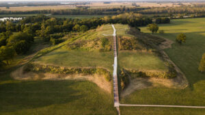 two-tiered grass mound with steps to the top