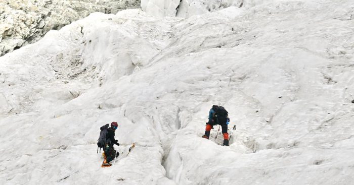 Climbers on a broken glaicer.