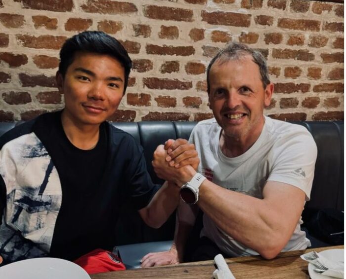 Nima Rinji Sherpa (left) and Simone Moro at a restaurant in Kathmandu.