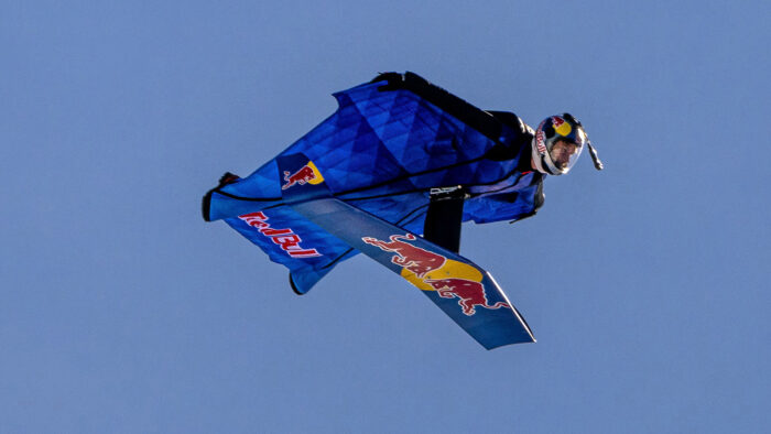 a man in a wingsuit with a foil