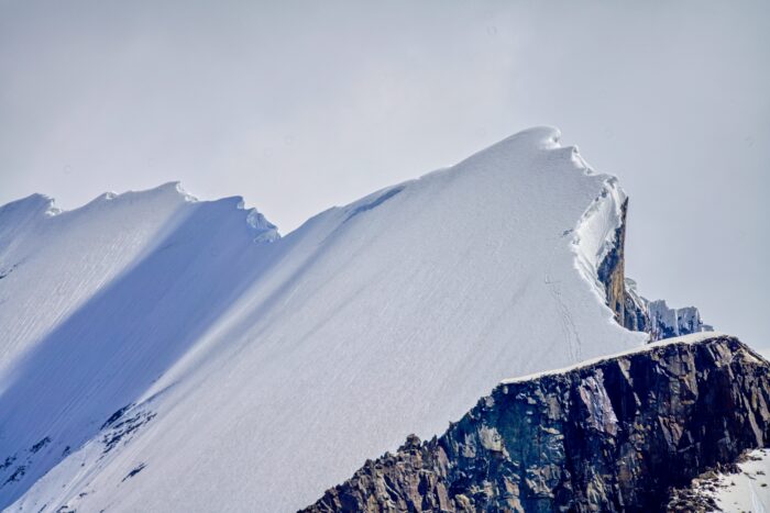 A sharp snow ridge.