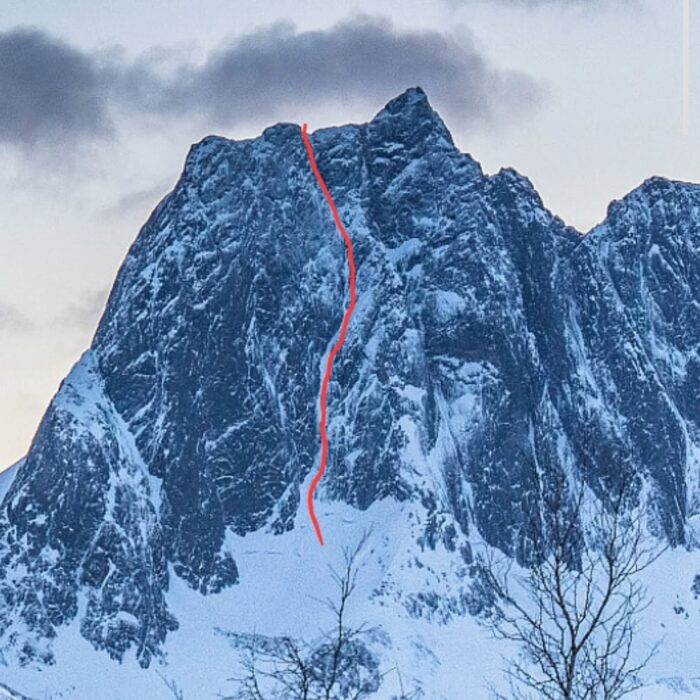 an ice line marked in red, on a mixed granite face.