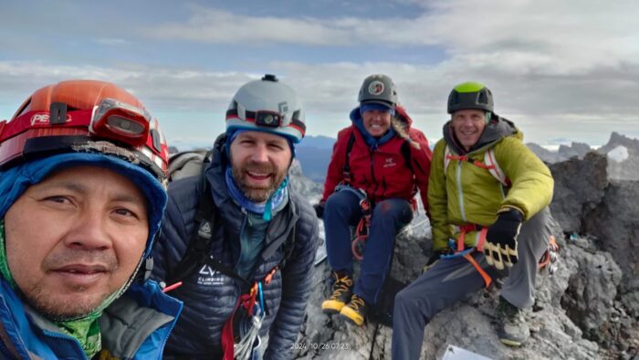Climbers' selfie on the summit of Carstensz pyramid