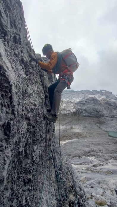 A climber on a rock climbing section on Carstensz Pyramid