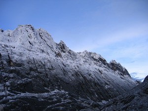 A rocky ridge with some snow powdering the flanks