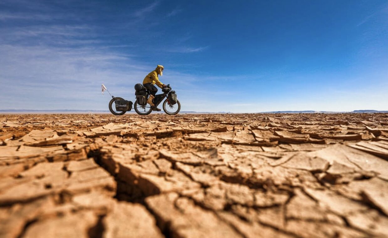 Mateusz Waligora on his bike in the Gobi.