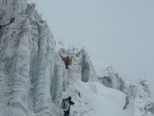 Nepalese climbers among water-ice seracs.