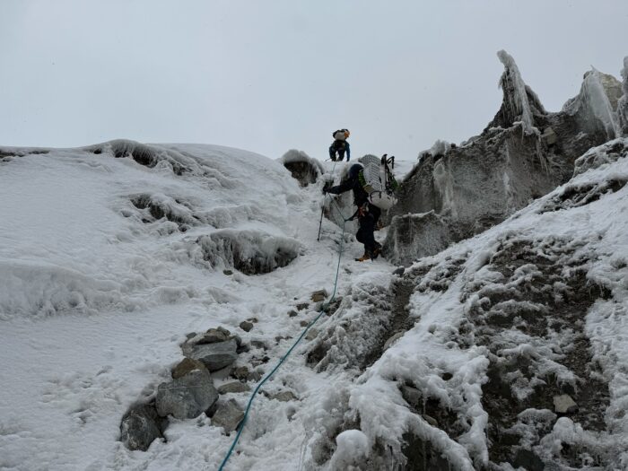 climbers trying to find a passage among a very broken glacier.
