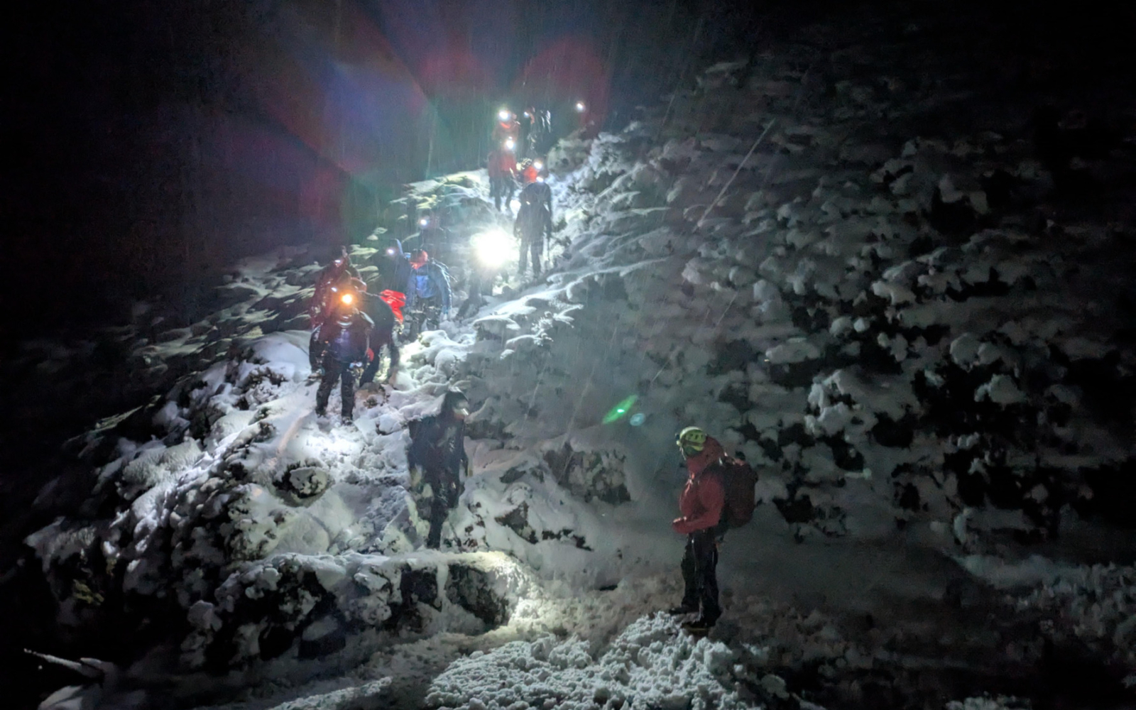 Climbers on a mountain at night.