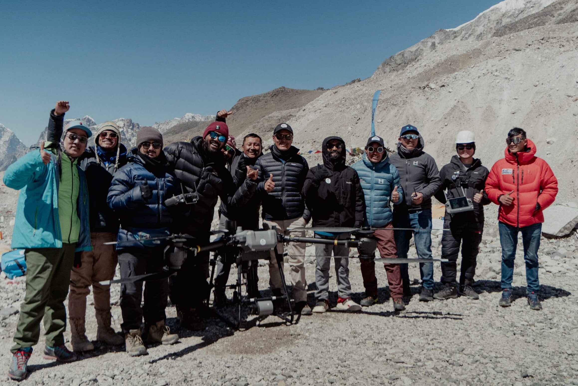 A group of Nepalese drone pilots with a large drone.