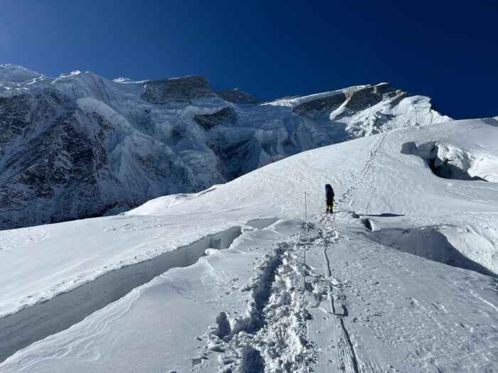 A climber clipped to fixed ropes on a glacier on Annapurna. 