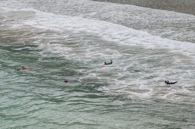 Surfers at Big Wave Bay, Hong Kong