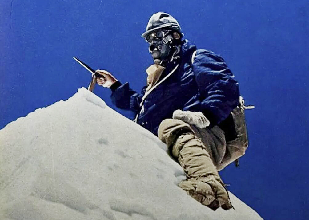 Couzy on the summit of Makalu, with 1950's gear and an O2 mask.