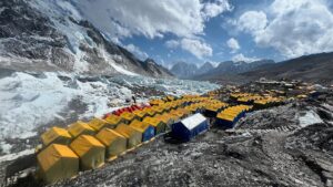 Nearly a hundred tents pitched in line on the Khumbu glacier, Everest.