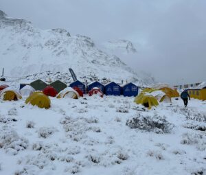 Tents in Annapurna Base Camp under a layer of snow.