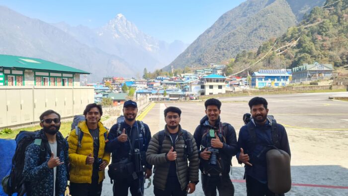 Drone operators give a thumbs-up at Lukla airport.