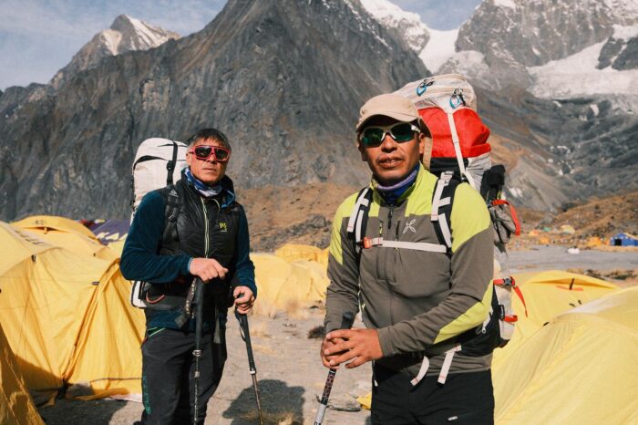 the climbers in light mountain clothes at Annapurna Base Camp 