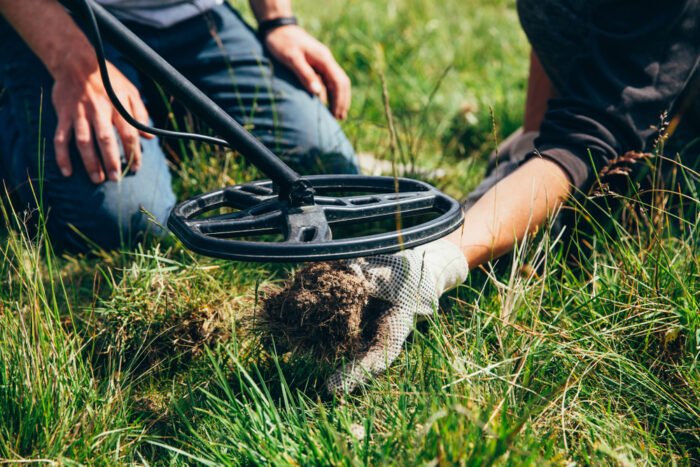 metal detector in grass