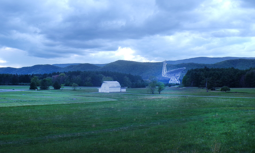distant shot of telescope and white barn