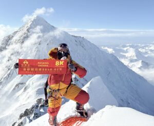 One of the Sherpa rope-fixers yesterday on the summit of Lhotse, with Everest in background.