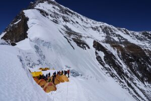 tents pitched close to each other on a snowloaded col on the north side of Everest.